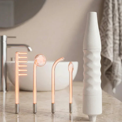 Appareil haute fréquence visage avec électrodes pour soins anti-âge sur lavabo de salle de bain